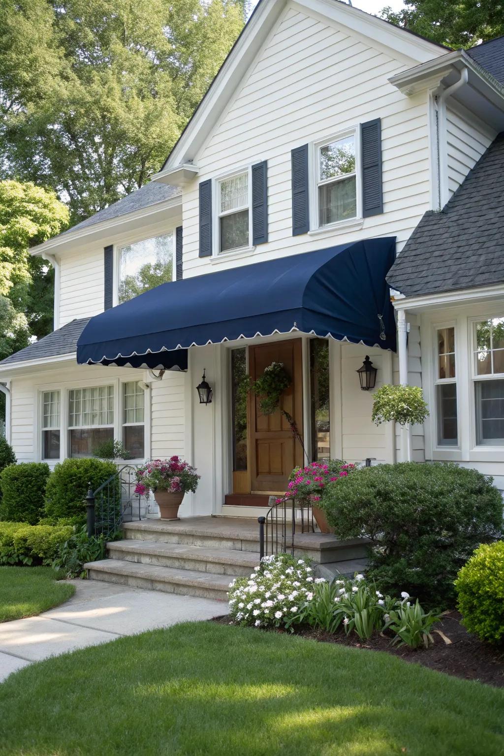 A classic navy blue awning adds a nautical touch to this home.