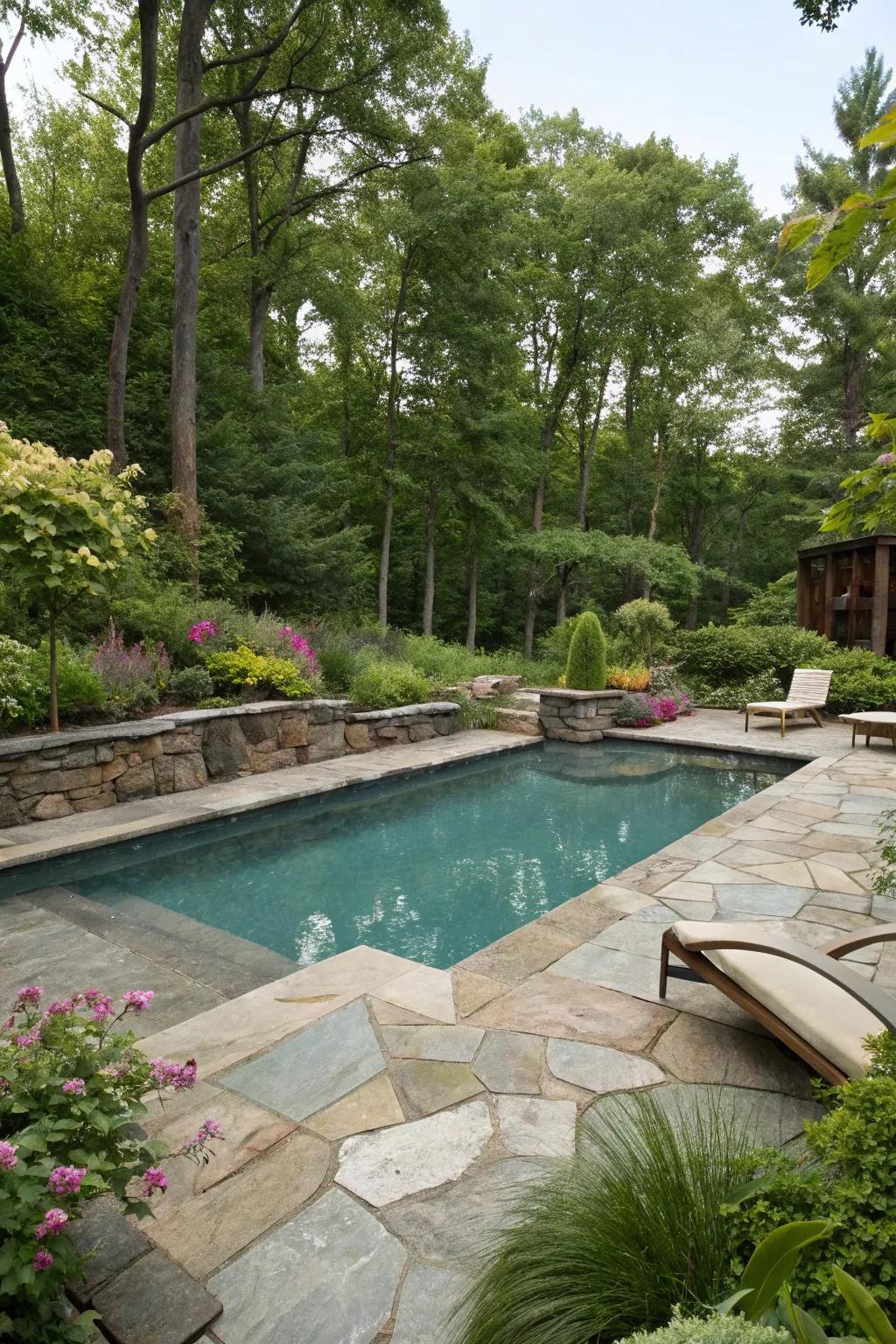 A backyard pool surrounded by natural stone and greenery for a rustic look.