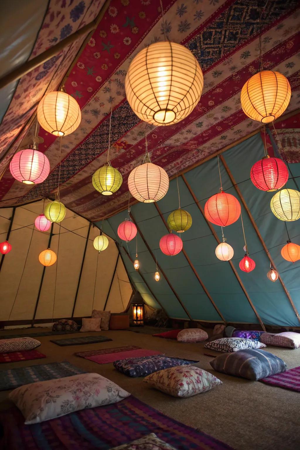 Vibrant paper lanterns add color and charm to this tent setting.