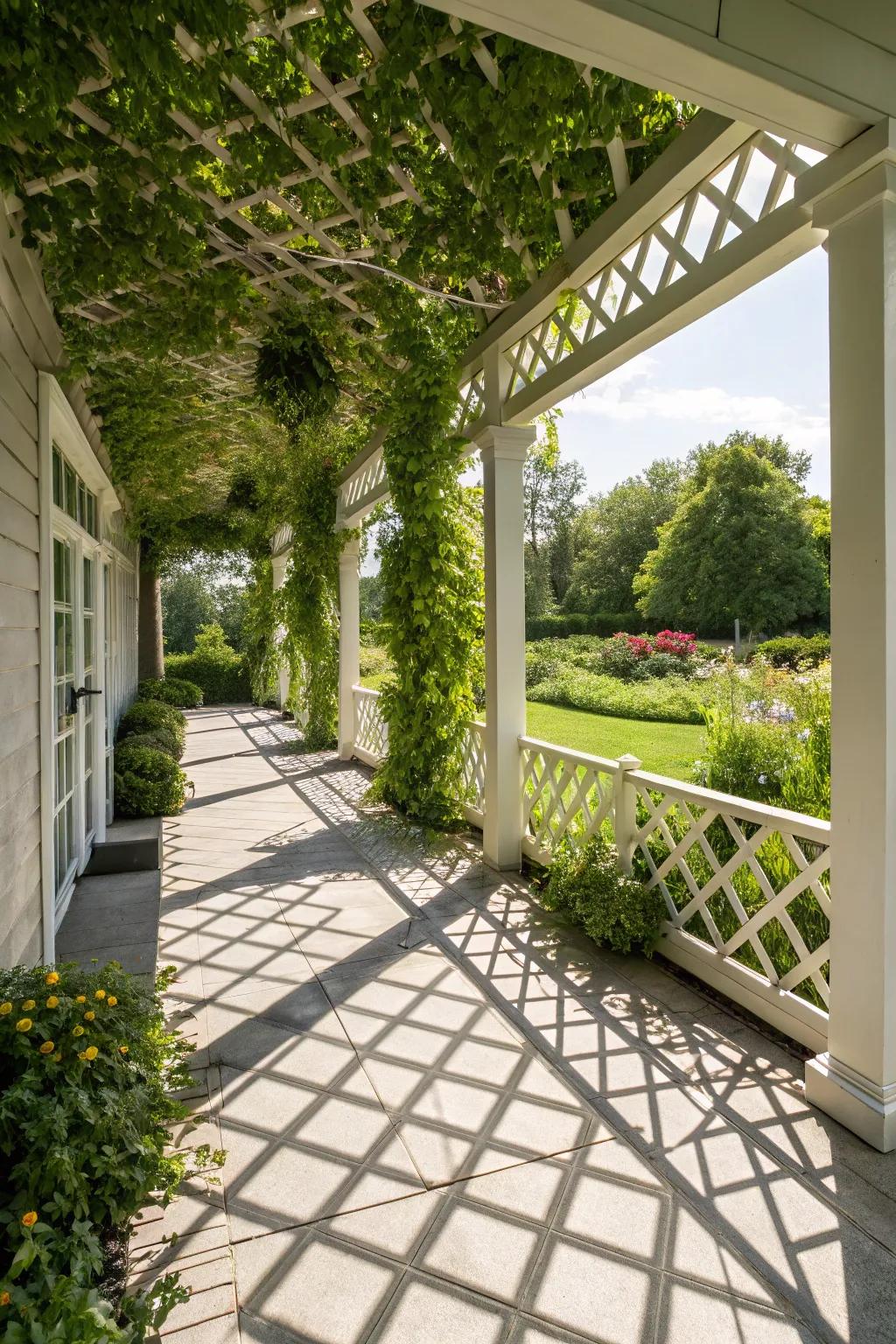 A modern front porch featuring a geometric trellis adorned with greenery.