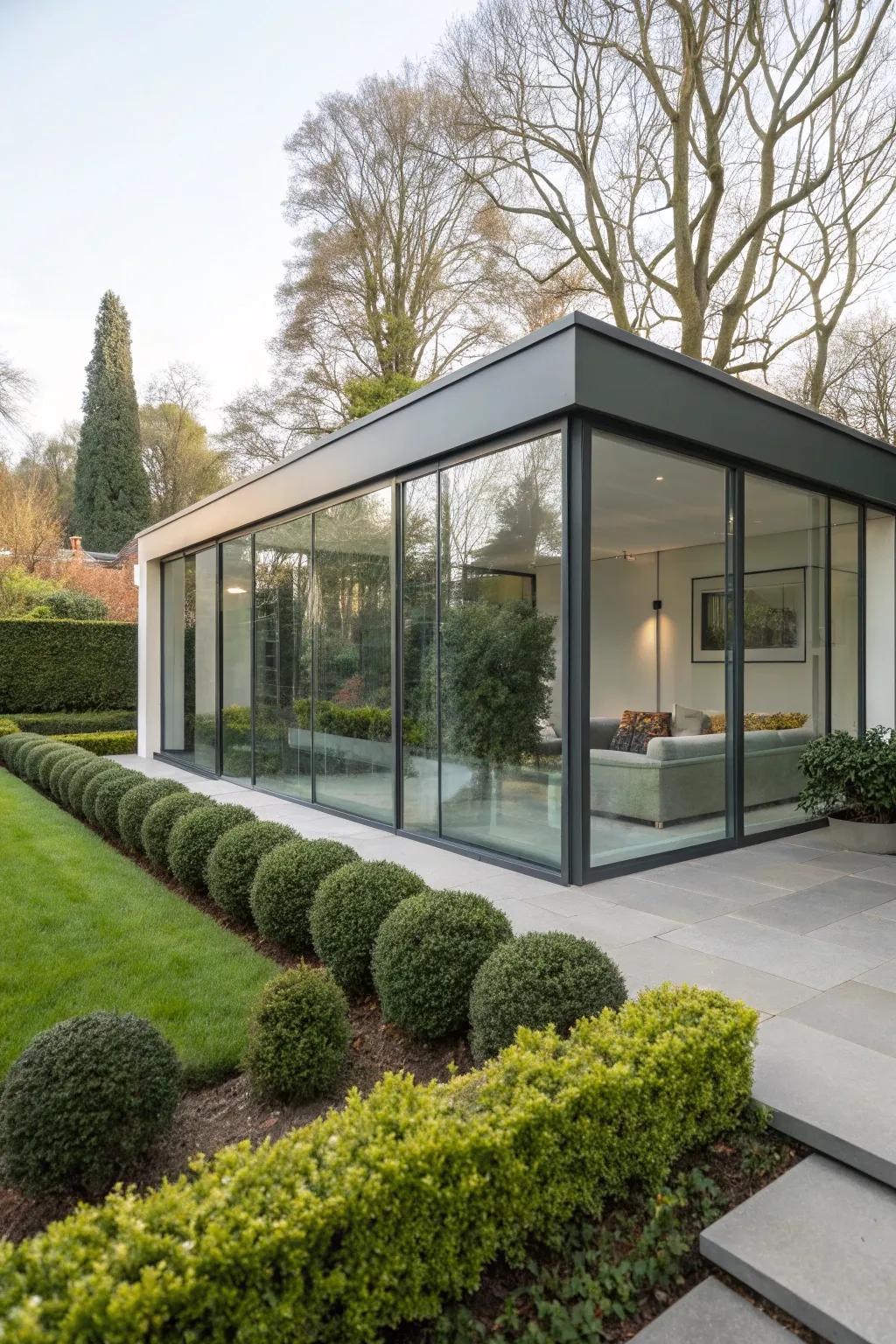A minimalist garden room with sleek lines and glass panels.