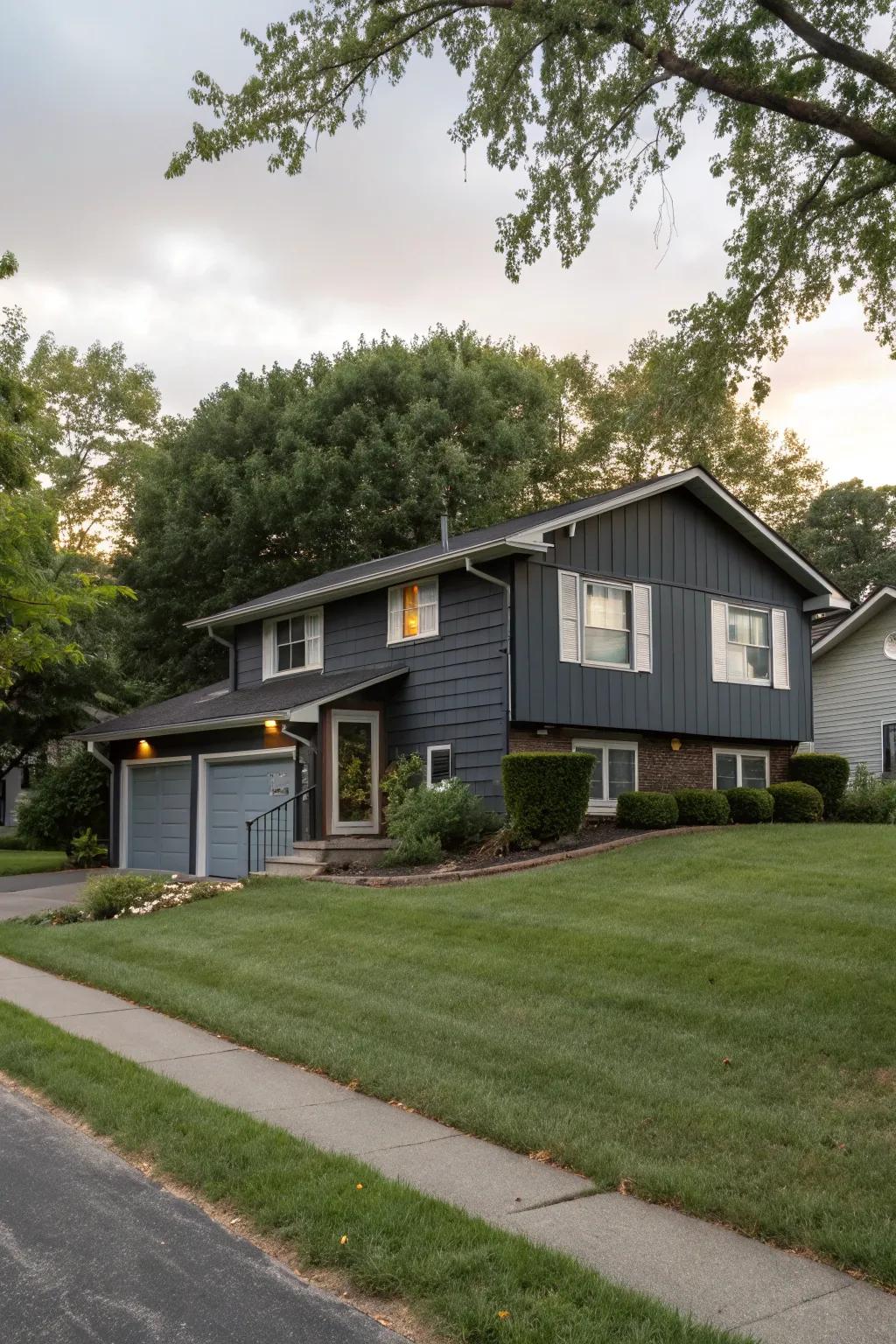 A split-level home boasting a modern dark gray exterior.