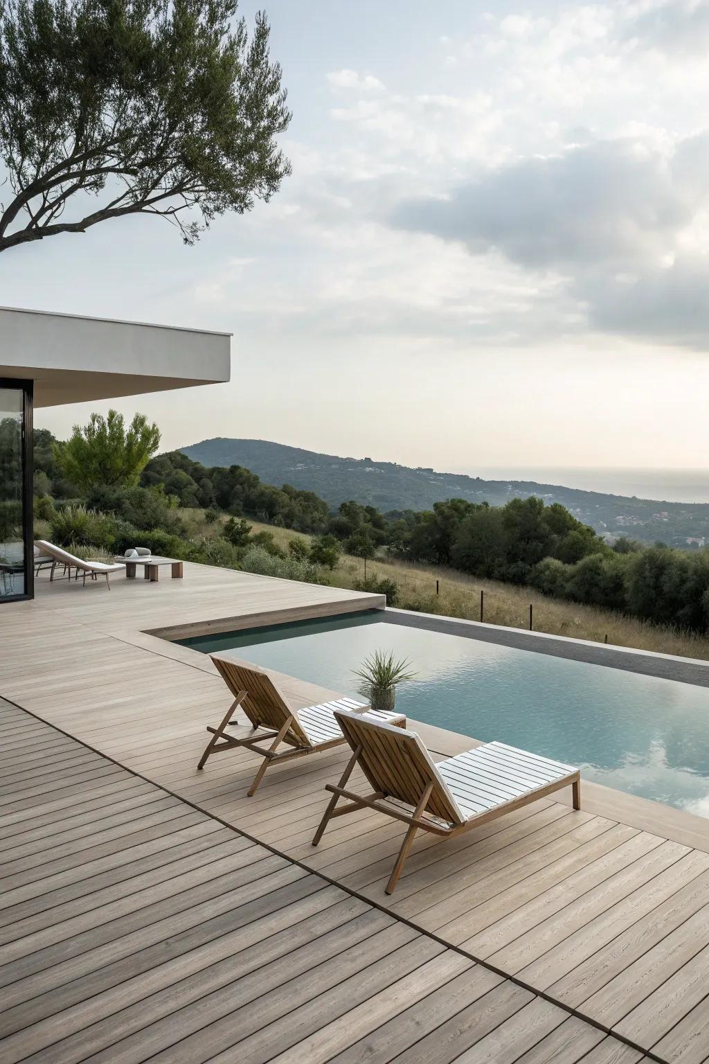 A minimalist wood pool deck that complements the pool's clean lines.