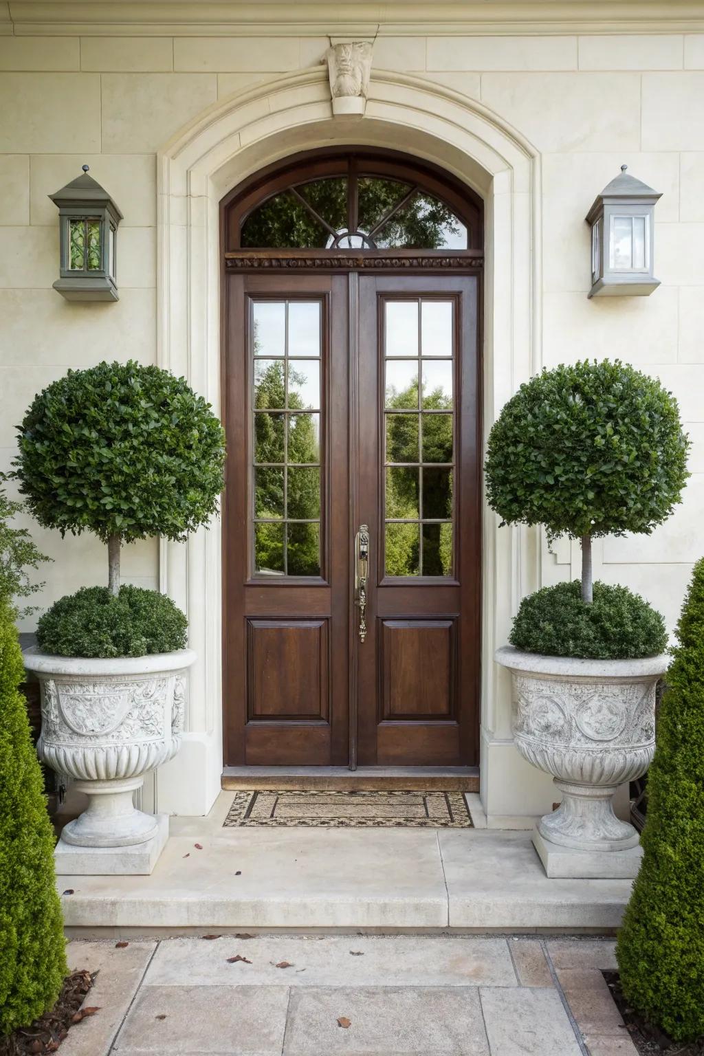 Create a grand entrance with boxwood planters.