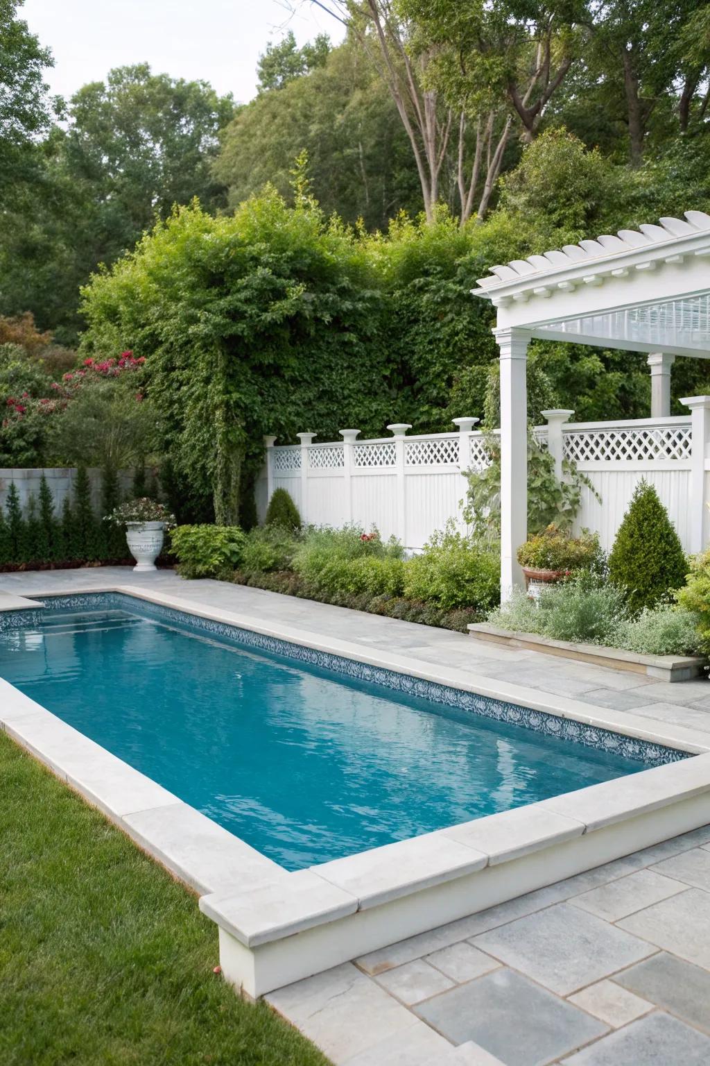 Classic white pool coping offers a timeless and cool look.