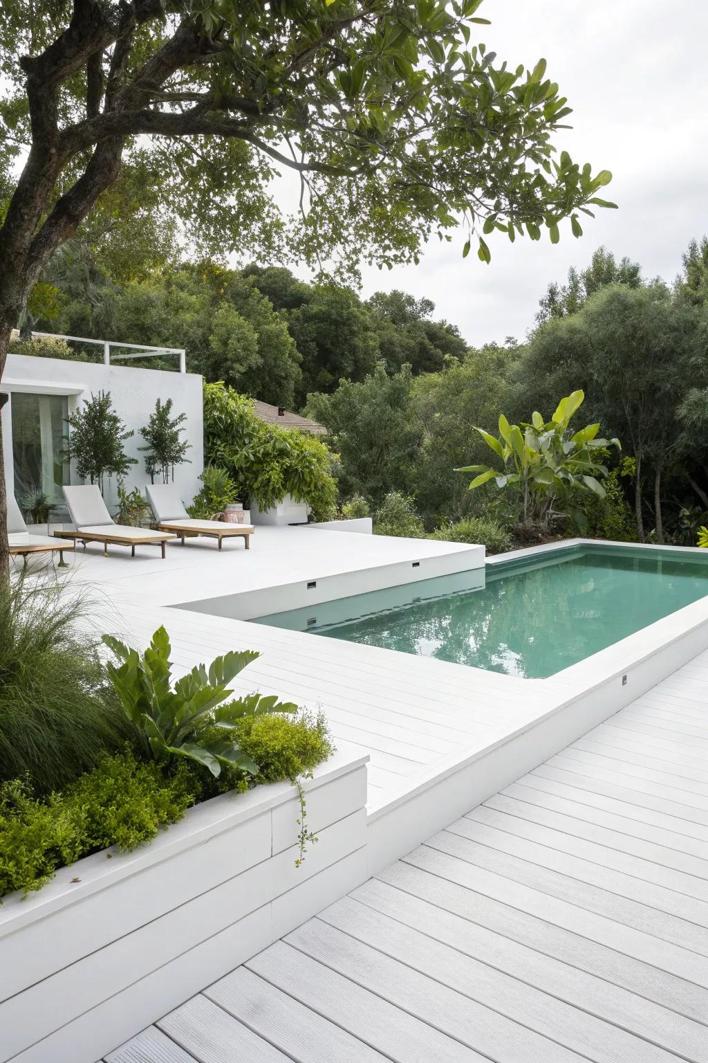 A classic white deck offers a clean, timeless look that complements any pool.
