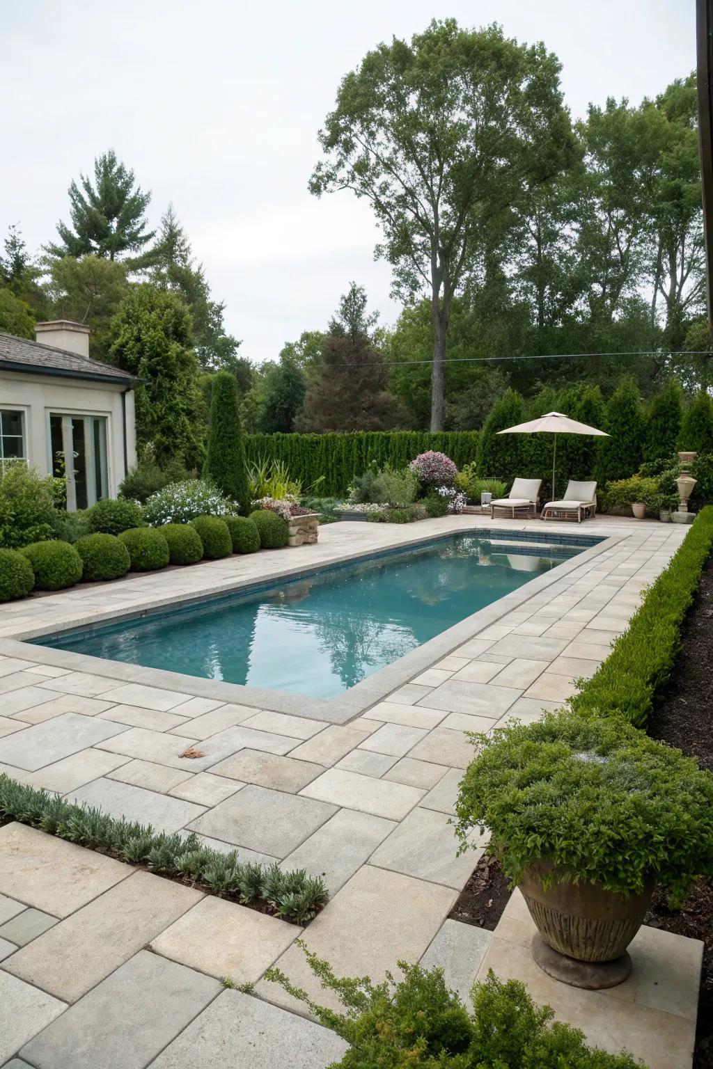 Classic concrete pavers bring timeless elegance to any pool deck.