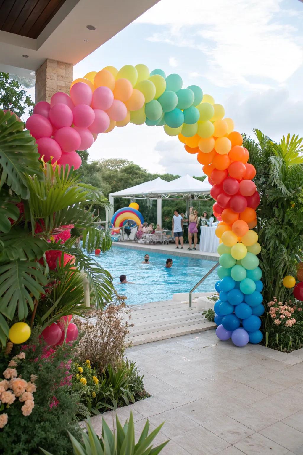 Colorful balloon arches welcoming guests to a festive pool party.