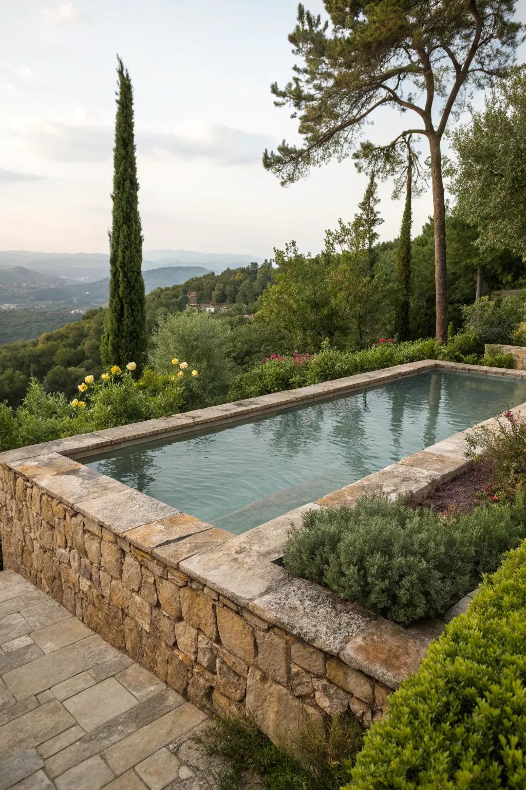 A raised pool featuring a natural stone design that complements its lush surroundings.