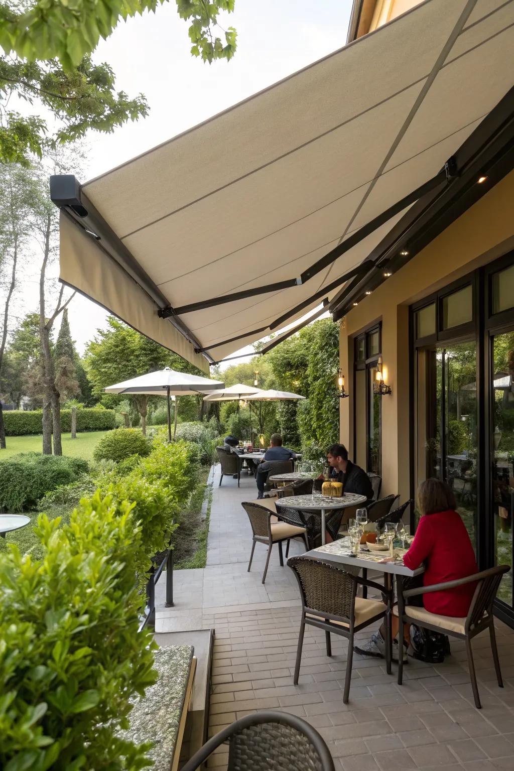 A cozy restaurant patio with a retractable awning providing shade.