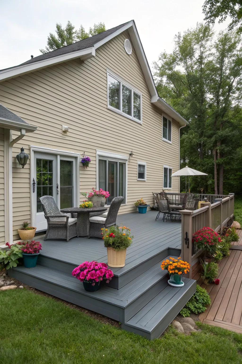 A slate gray deck providing a sleek contrast to a beige house.