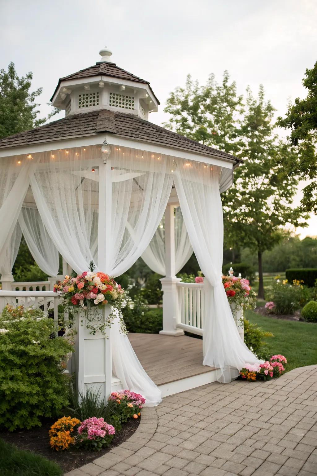 Ethereal white drapes transform this gazebo into a romantic haven.