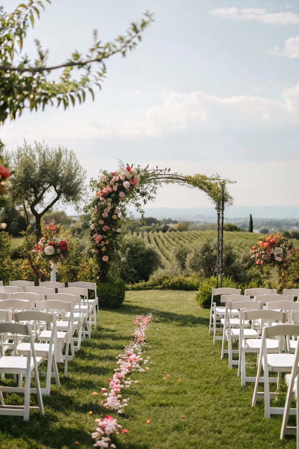 A garden wedding ceremony with a floral arch and elegant seating