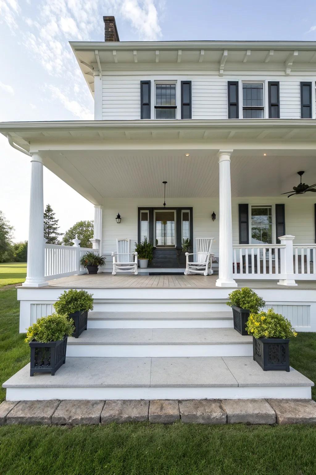 Symmetrical design on a white house porch creates visual harmony.