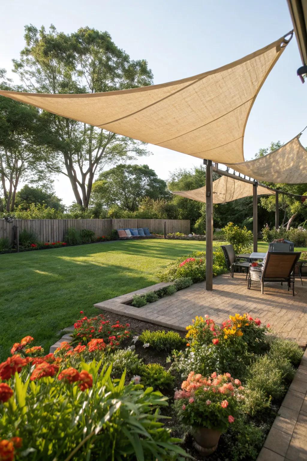 Eco-friendly sail shades offering sustainable shade solutions in a backyard.