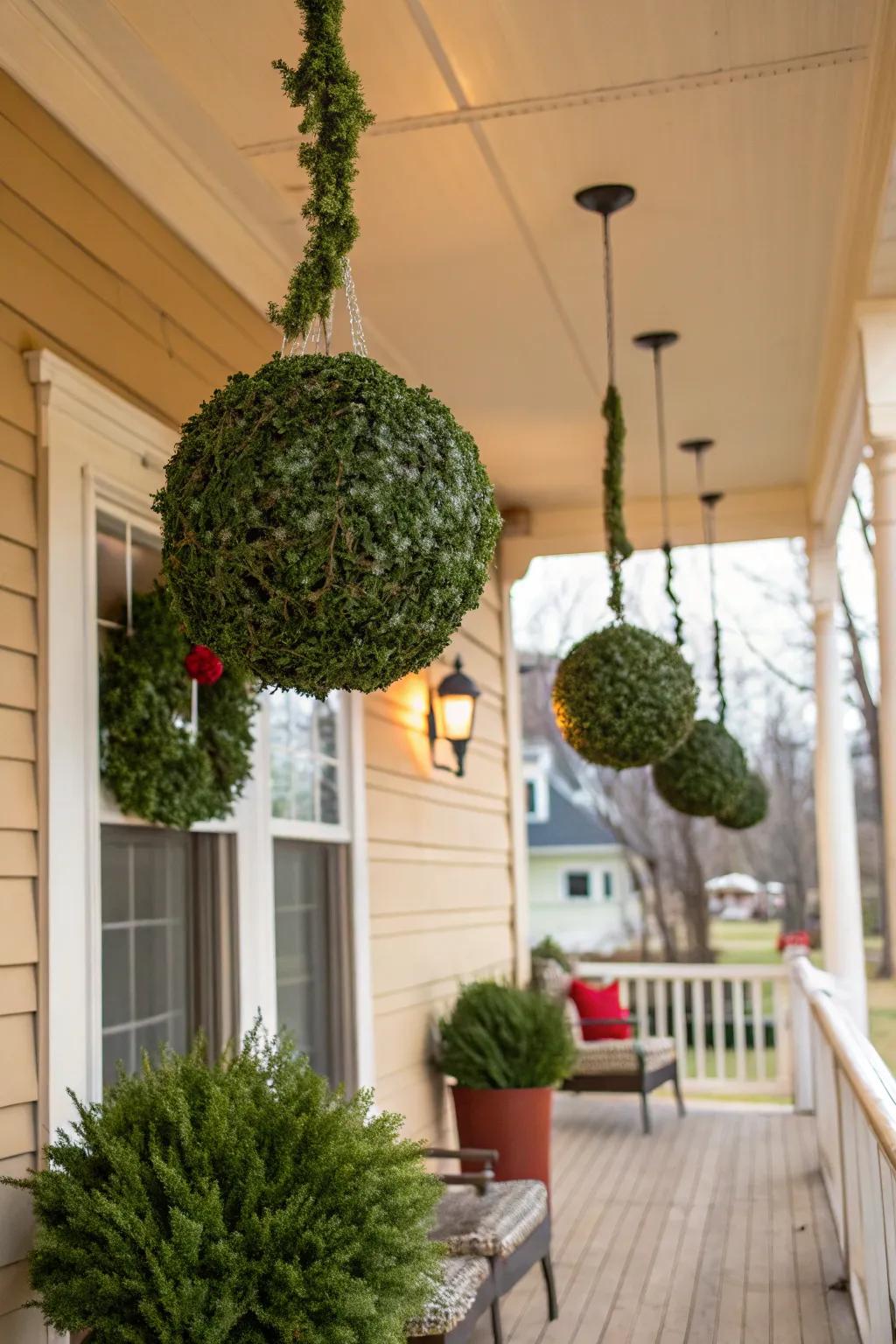 DIY kissing balls add an elegant touch to the porch.
