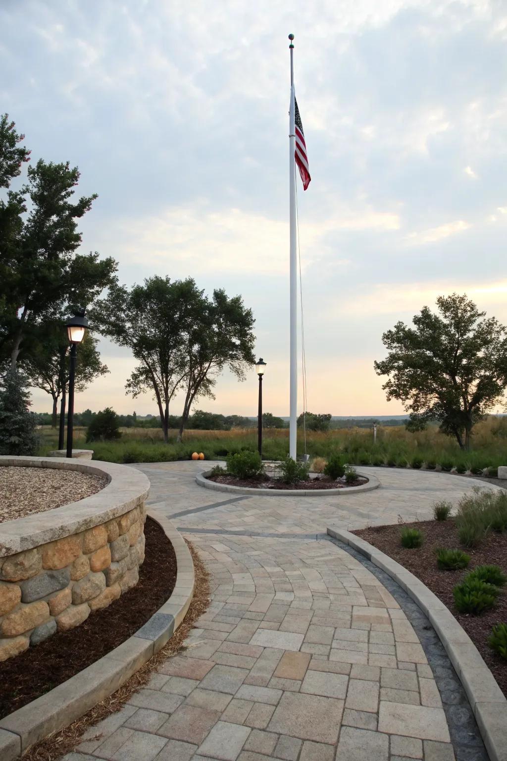 Hardscaping with stone pavers enhances the flagpole's elegance.