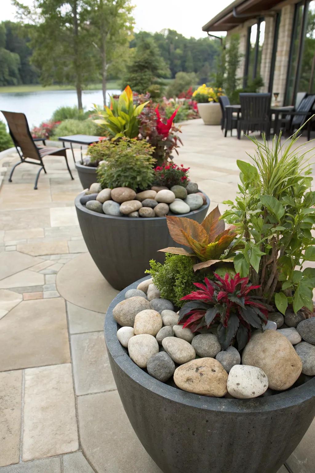 Decorative planters enhanced with large river rocks.