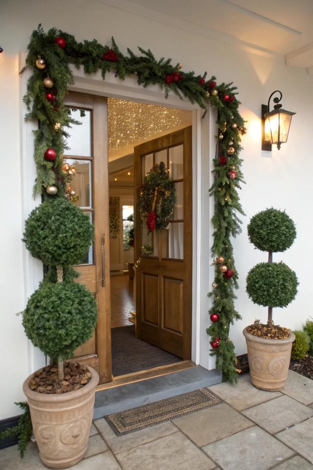 Potted topiary complements garland for a sophisticated entrance.