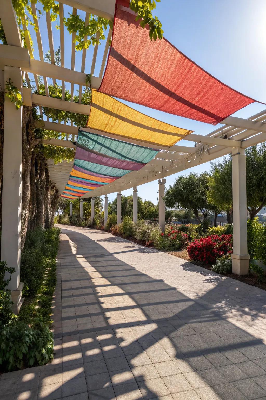 Modern sunshade sails providing cover for a pergola