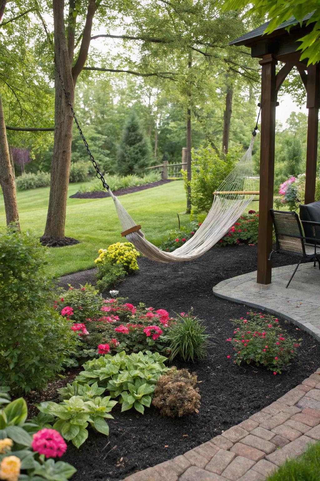 A relaxing garden oasis featuring black rubber mulch.