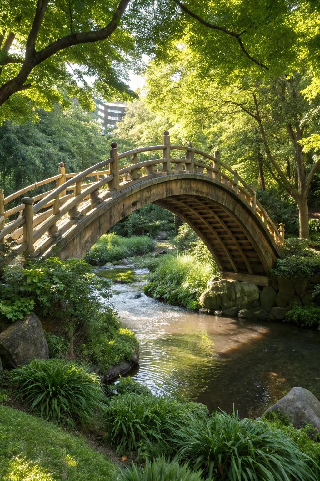 A curved bamboo bridge adds an exotic touch to the natural landscape.