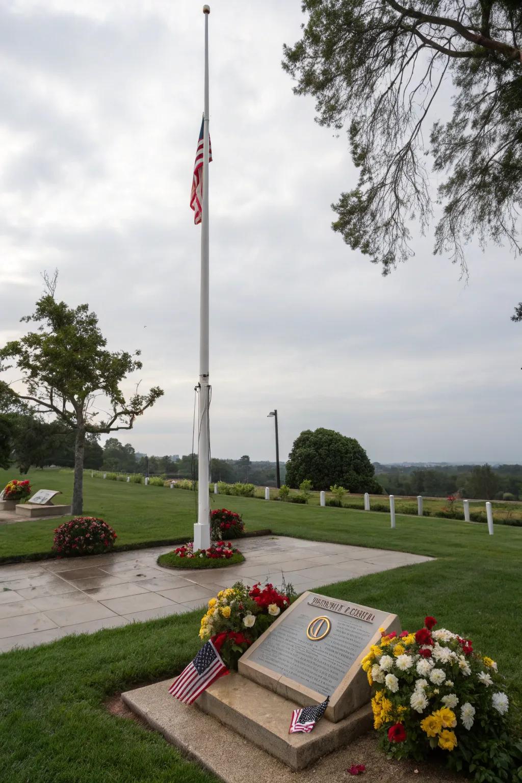 A memorial plaque adds depth to the flagpole display.