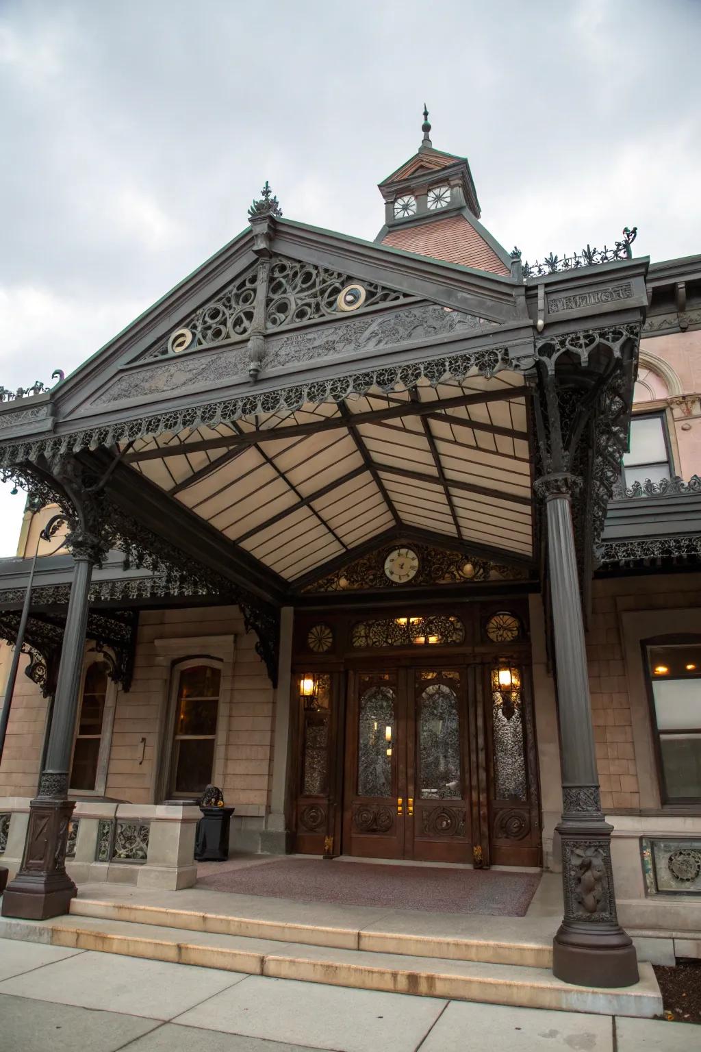 A gabled metal awning adds grandeur to the entrance.
