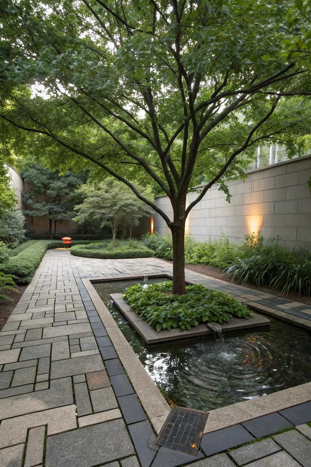 A calming water feature nestled within pavers around a tree.
