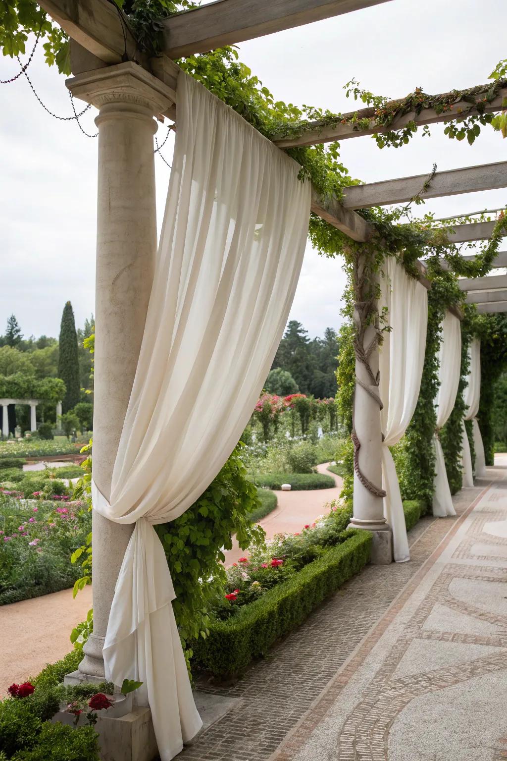 Drapes add privacy and elegance to this pergola.