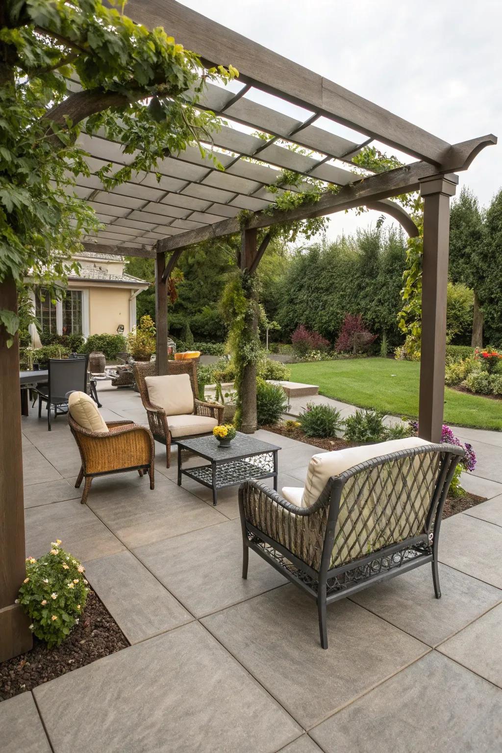 A resin patio beautifully complemented by a pergola for shade.