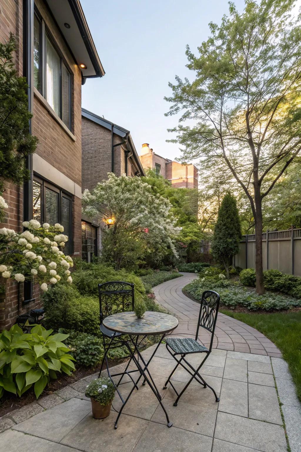 A small patio creating a cozy retreat in a townhouse front yard.