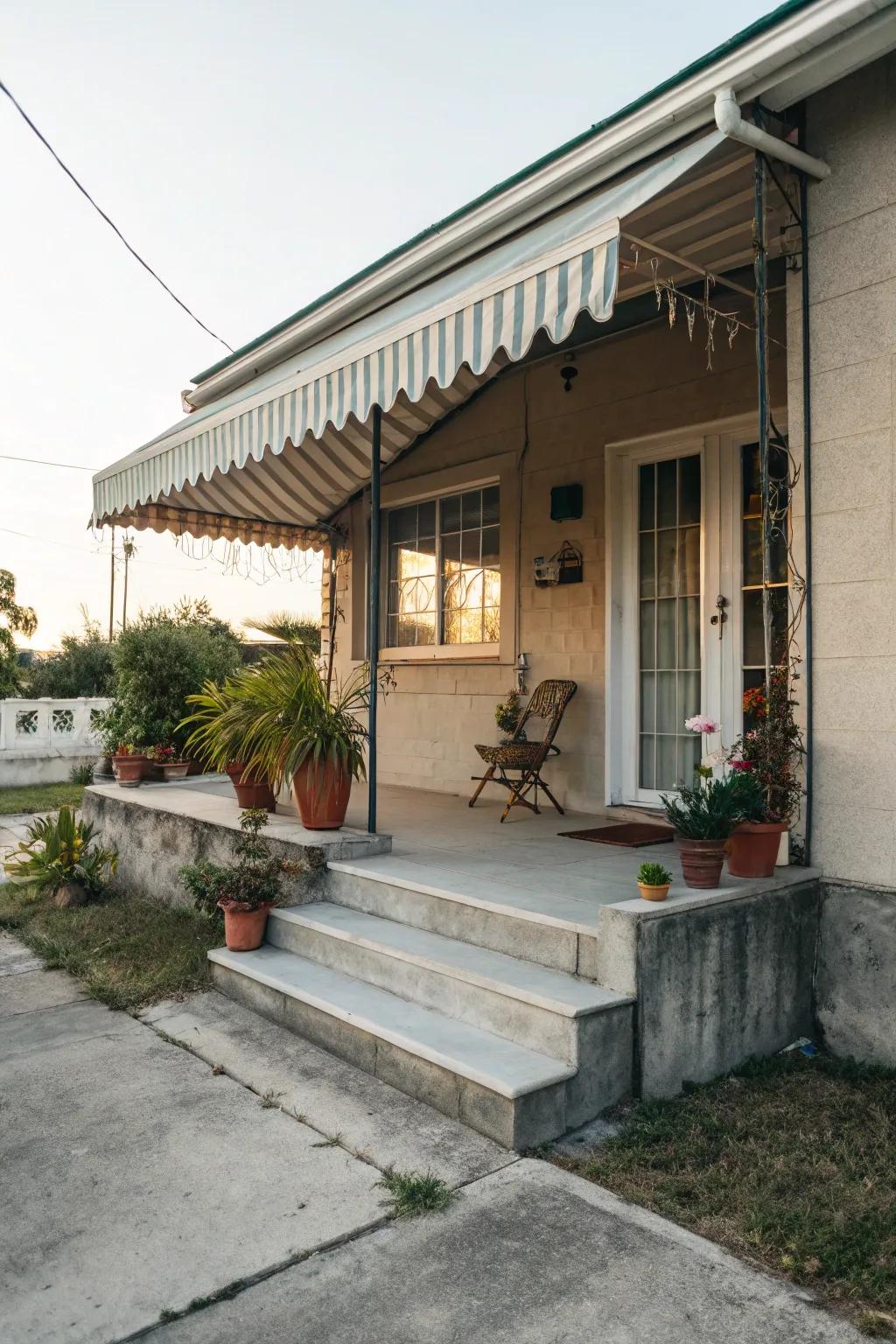 Concrete porch with a cozy, protective awning.