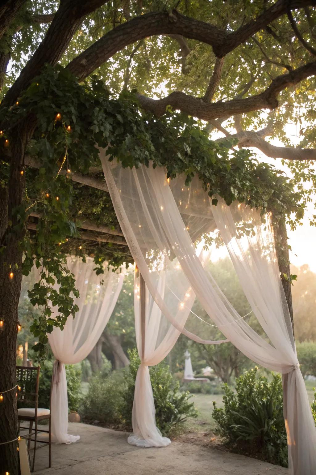A dreamy tulle canopy draped over tree branches, perfect for a fairy tale setting.
