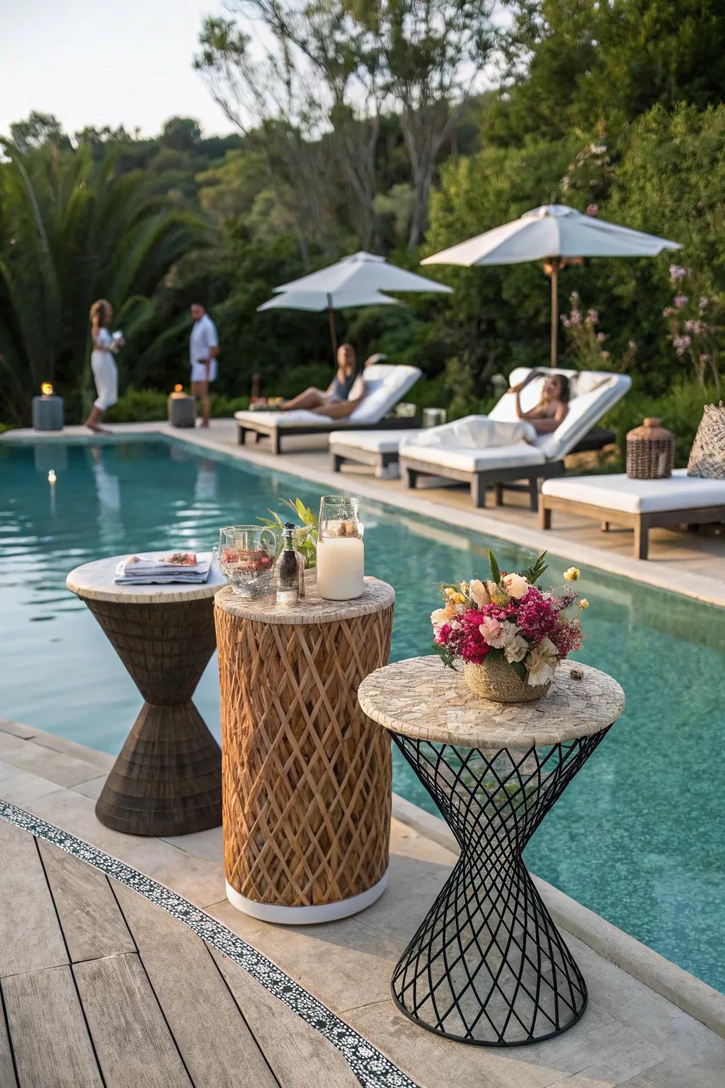 Sculptural side tables add flair and functionality to the poolside.