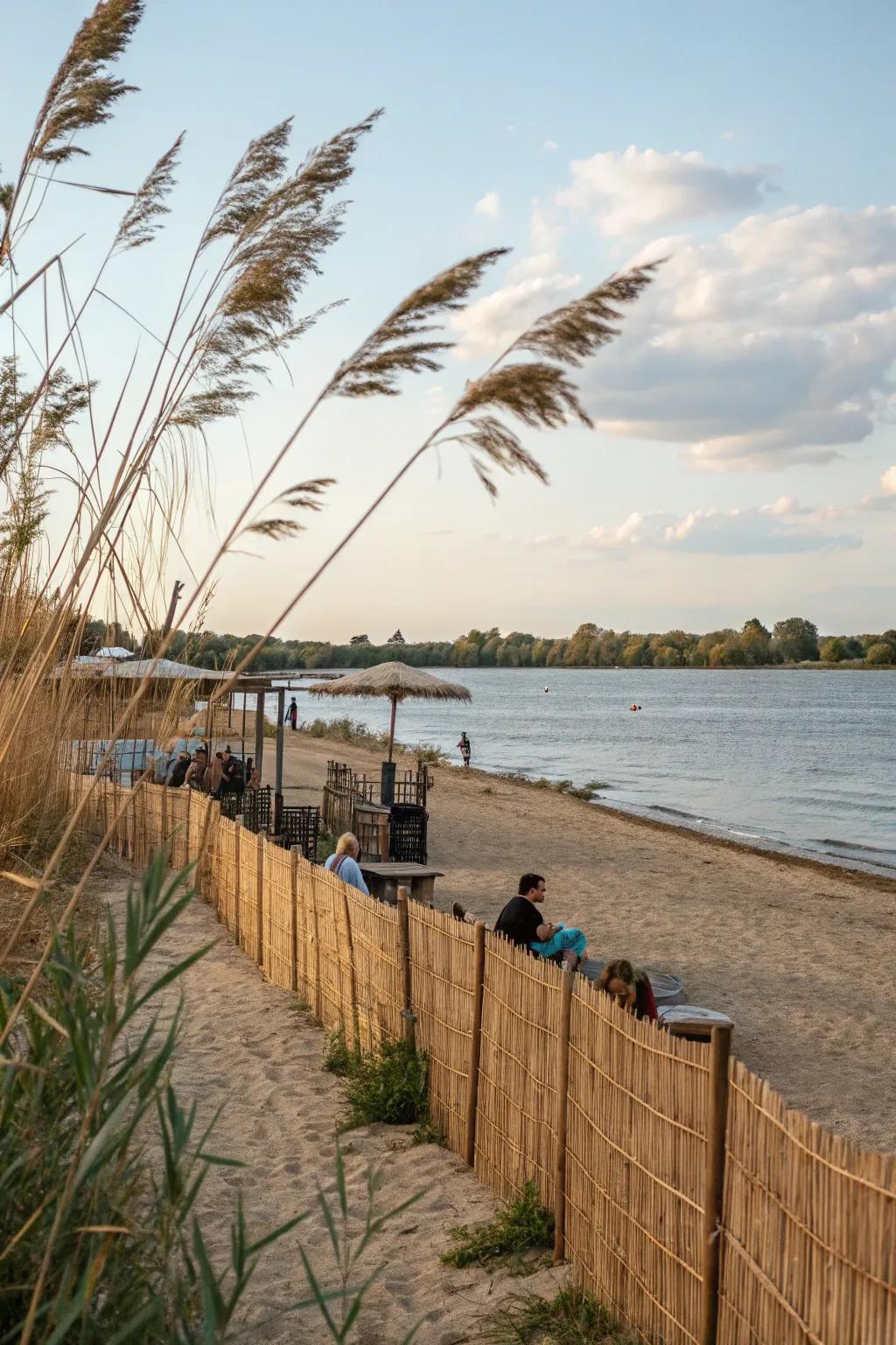 Reed fencing adds a boho touch to this relaxed waterfront area.