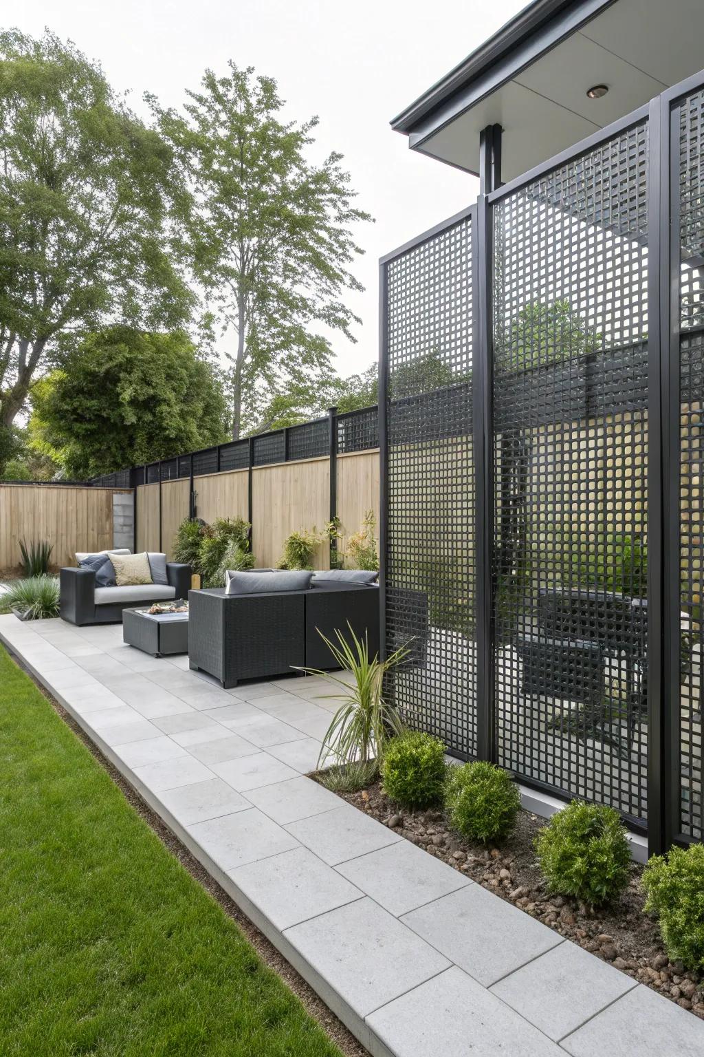 Perforated metal fences offer contemporary style with wind-reducing capabilities.