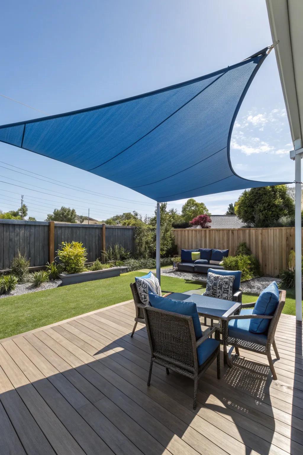 A shade sail offers stylish sun protection on a side deck.
