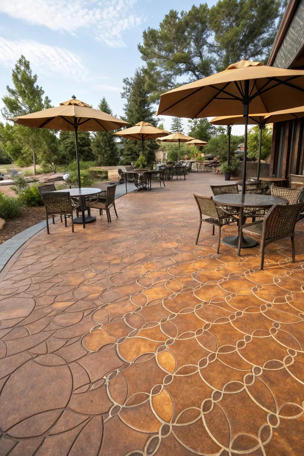 An artistic outdoor dining area featuring amber fish scale pattern stamped concrete.