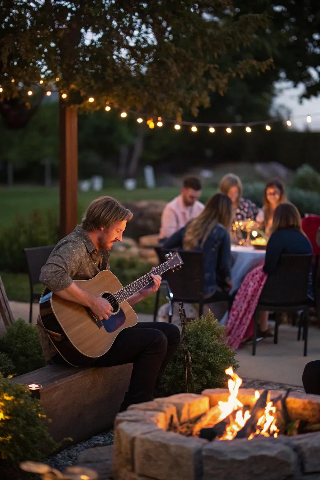 An acoustic musician setting the mood by the fire pit.