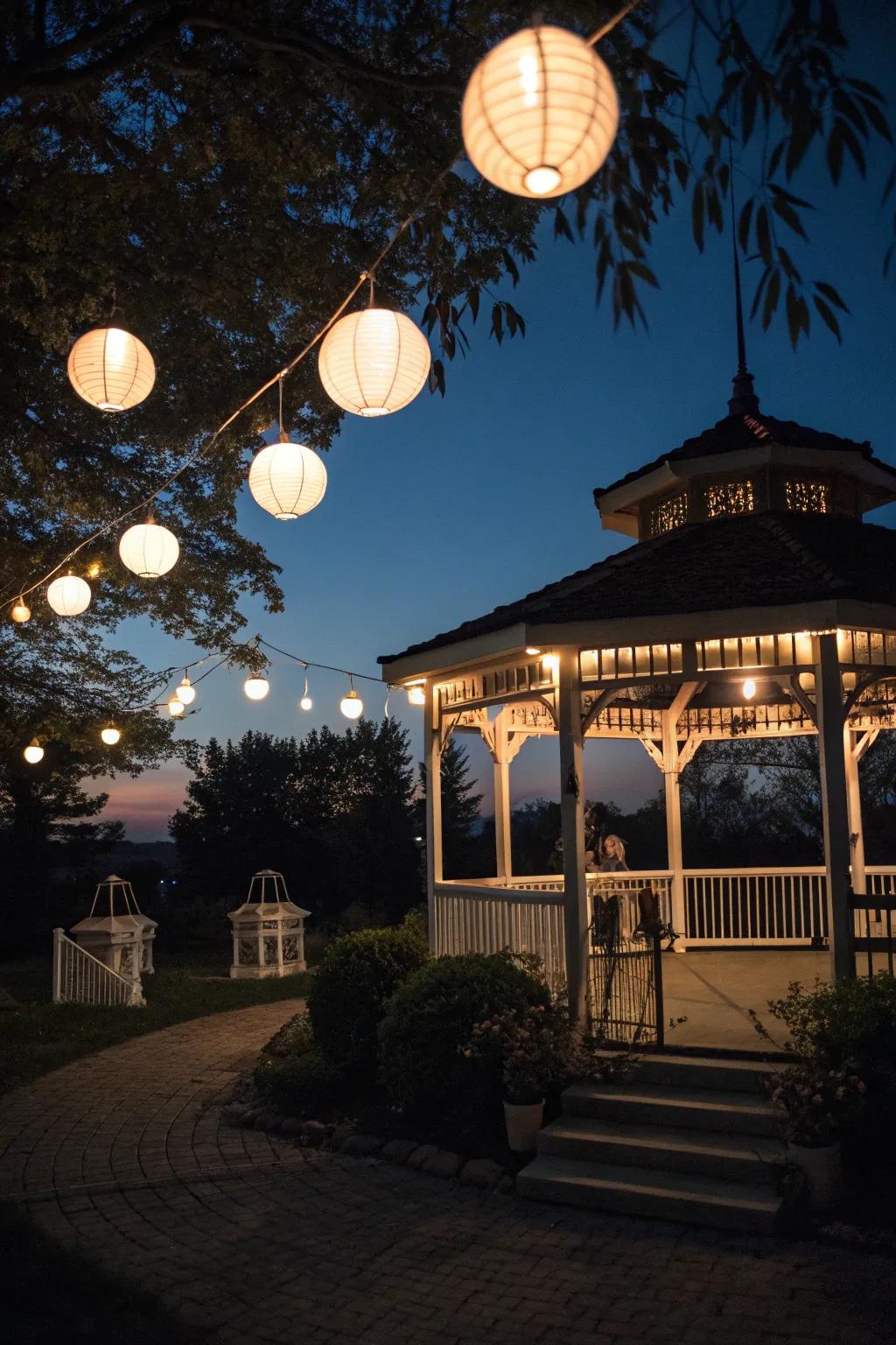 A gazebo softly illuminated by classic lanterns.