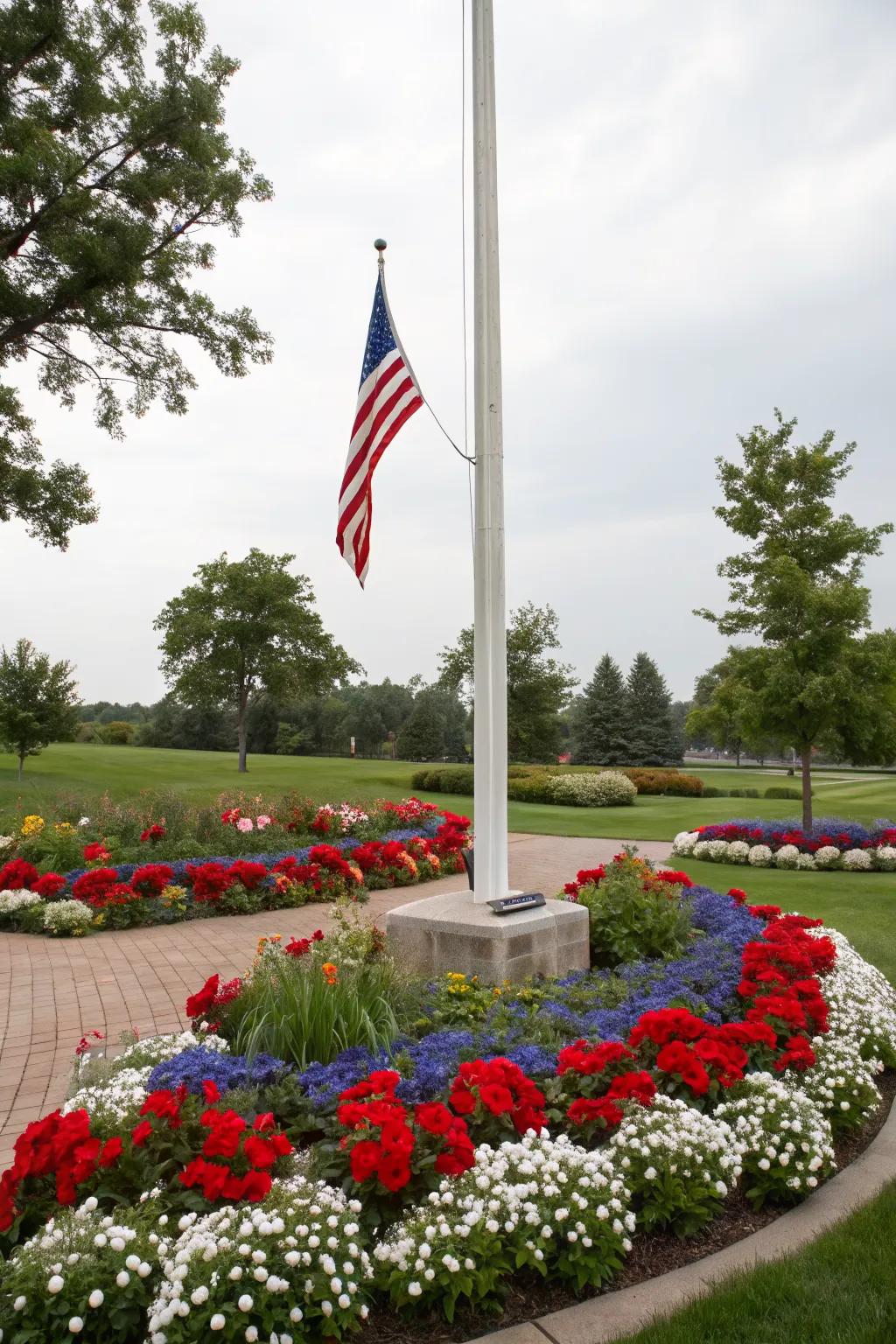 Patriotic flower arrangements add a vibrant touch to the flagpole.