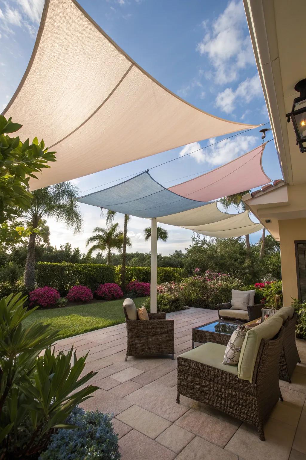A stylish patio shaded by elegant shade sails.