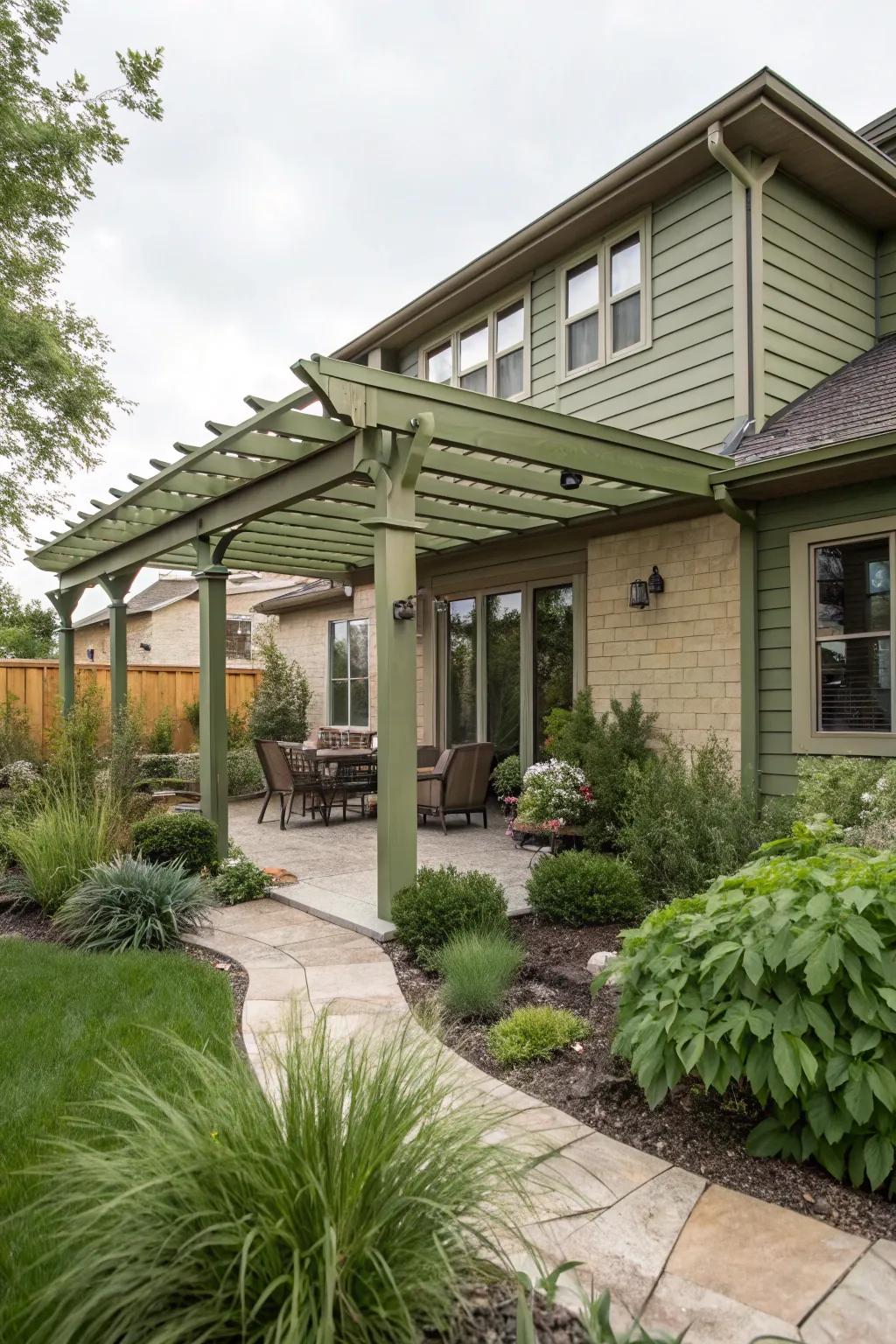 Olive green pergolas create a harmonious transition to natural surroundings.