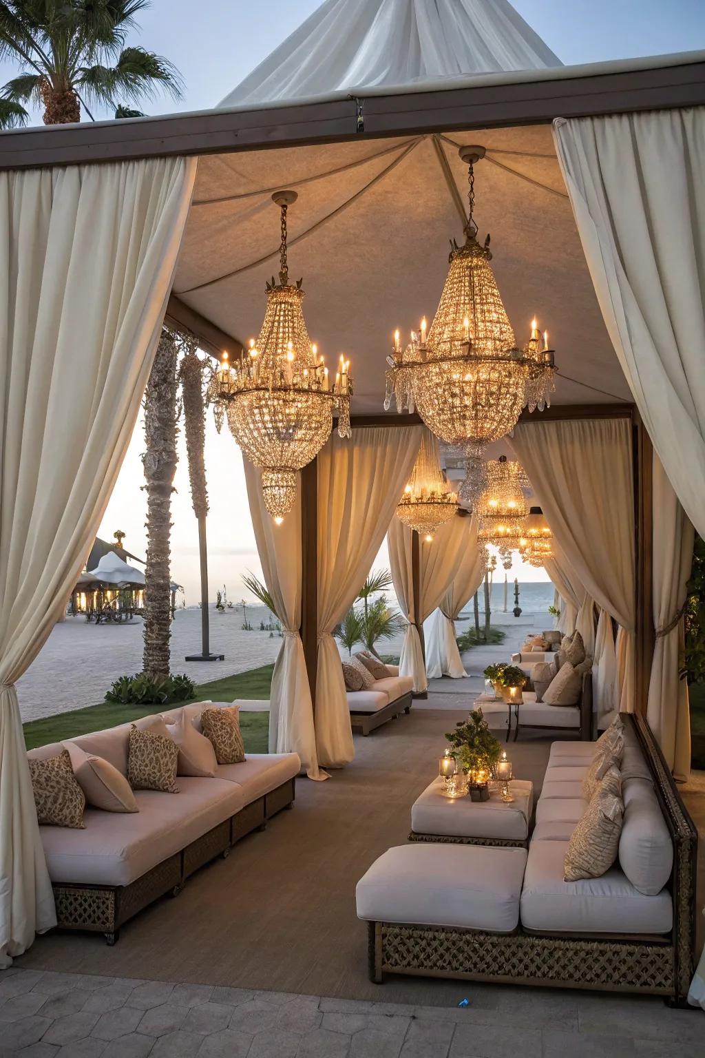 A glamorous cabana featuring plush seating and elegant chandeliers for a luxurious feel.
