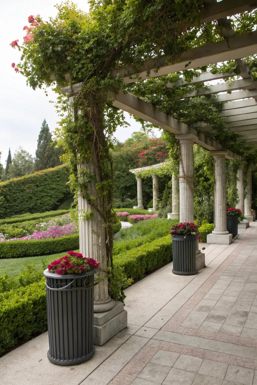 A pergola with draping plants offers an elegant and architectural solution for trash storage.