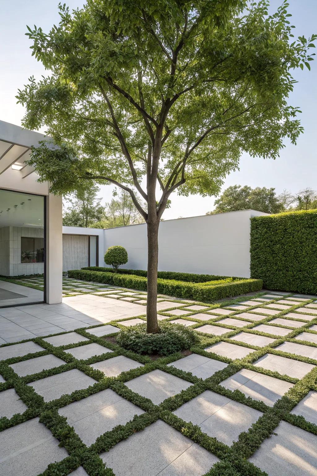 A modern geometric paver layout surrounding a tree.