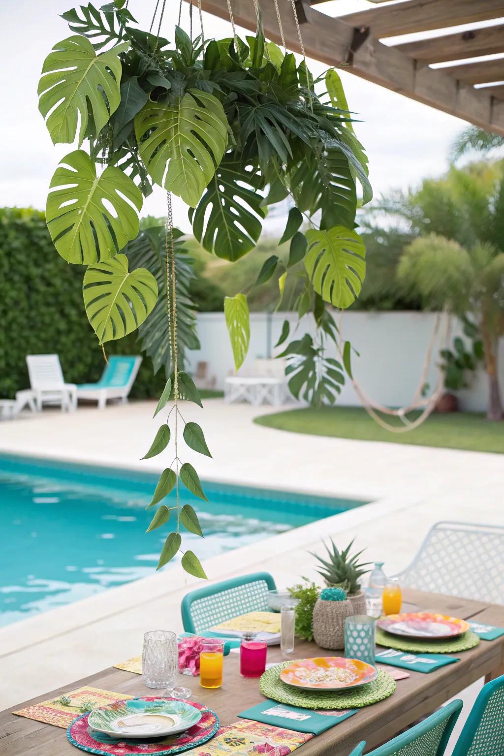 A tropical leaf garland adds a lush, green touch to the decor.
