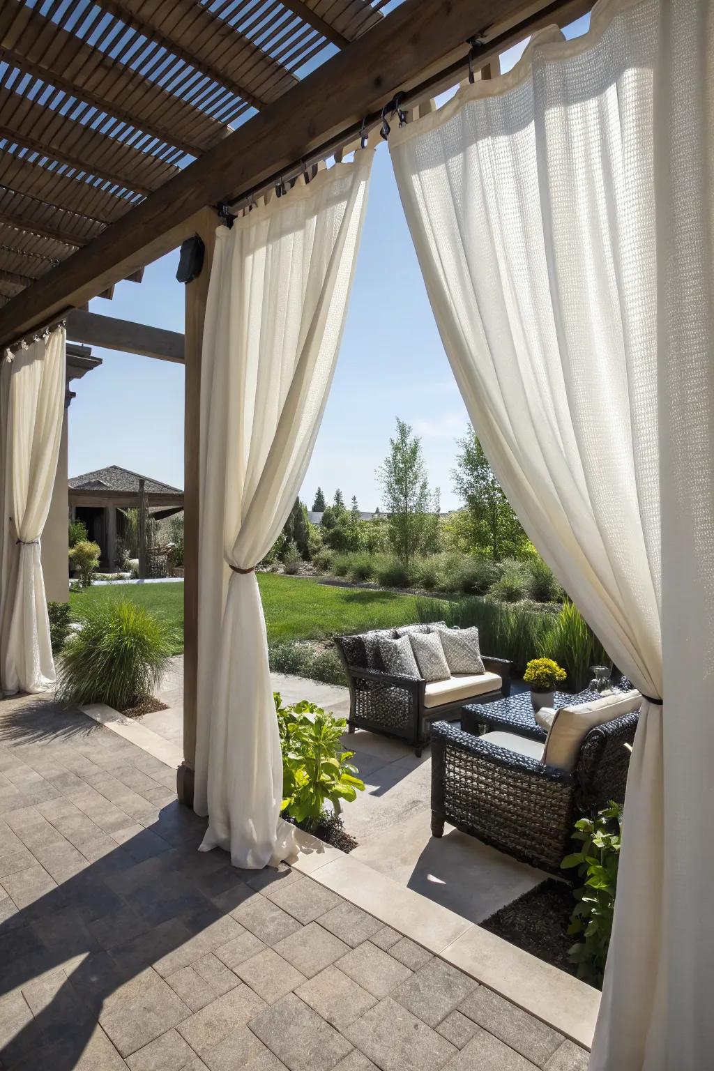 Outdoor curtains add privacy and a touch of elegance to this patio.