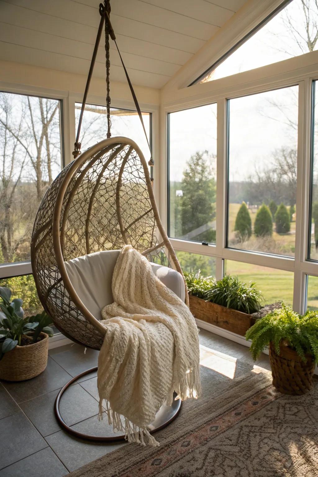 A hanging egg chair creates a cozy nook in this serene sunroom.